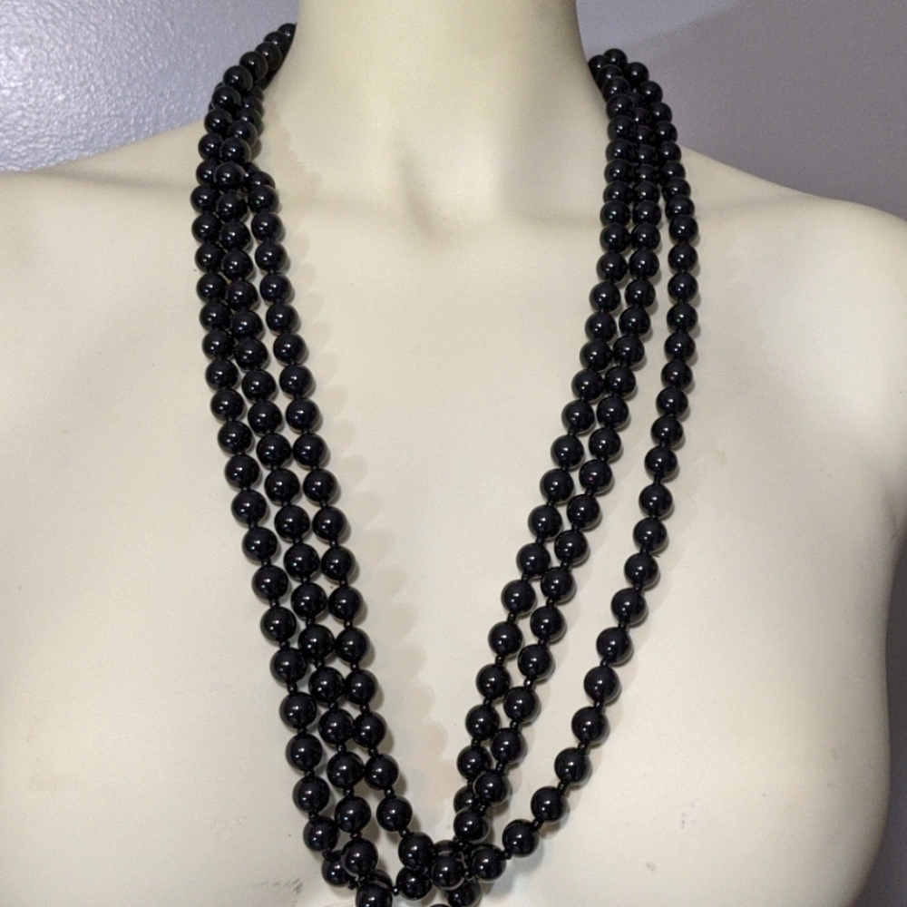 Multi strand black beaded necklace .Mark